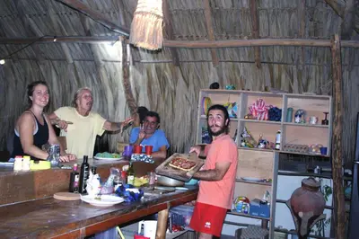 a group of people standing in a room at Hostel Nugeku in Rincón