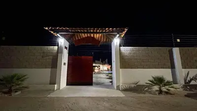 a entrance to a building at night with lights at Cabaña Villa Linda in Juan de Acosta