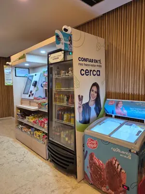 a store with a corned beef refrigerator next to a sign at 1H Encanto Rentals @ Sunno Beach in Cartagena de Indias