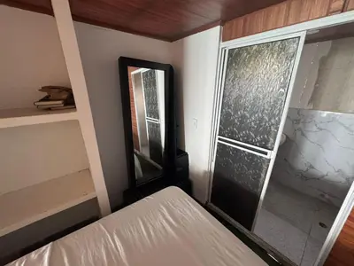 a bedroom with a bed and a large window at HOSTAL LAMAR BARU dónde Gertrudis in Playa Blanca