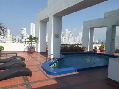 a swimming pool on the roof of a building at APTO DUPLEX MARINA DEL REY CARTAGENA in Cartagena de Indias