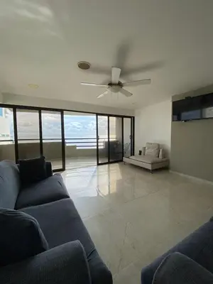 a living room with a couch and a ceiling fan at APTO DUPLEX MARINA DEL REY CARTAGENA in Cartagena de Indias