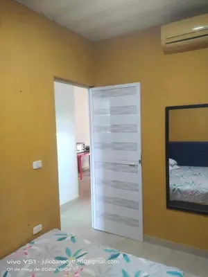 a bedroom with a closet and a door with a bed at Casa Murillo in San Antero