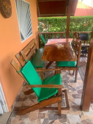 a table and chairs sitting on a patio at Cabaña El Esplendor in San Bernardo del Viento