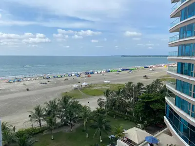 a view of the beach from the balcony of a building at Sunshine 503 Beautiful SeaView 2Beds2bath w AC front Beach in Cartagena de Indias