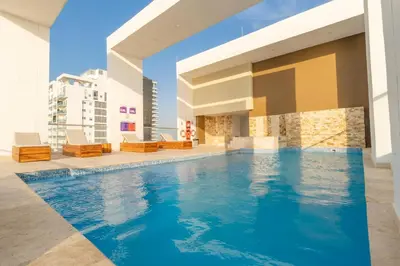 a swimming pool in the middle of a building at Luxury Sea View Duplex in the Heart of the City in Cartagena de Indias