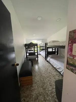 a room with two bunk beds and a door at La casa de flor in Cartagena de Indias