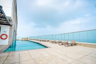 a swimming pool on the roof of a building at U-GO Palmetto Beach - Lujo Frente al Mar in Cartagena de Indias