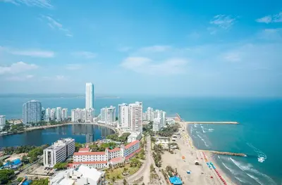 an aerial view of a city and the ocean at U-GO Palmetto Beach - Lujo Frente al Mar in Cartagena de Indias
