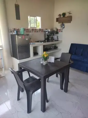 a living room with a table and two chairs at Apartamento Dorado Sunset in Santa Marta