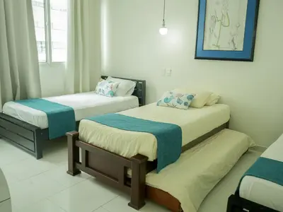 a room with two beds and a window at Morros 3 in Cartagena de Indias