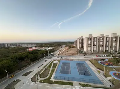 an aerial view of a building with a tennis court at Apto nuevo al lado de la UNorte, 10 Min Buena vista Grav vista in Barranquilla