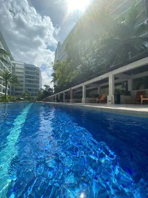 a swimming pool with blue water in front of a building at Cartagena Apartamento en Morros en Primera Linea de PLaya in Cartagena de Indias