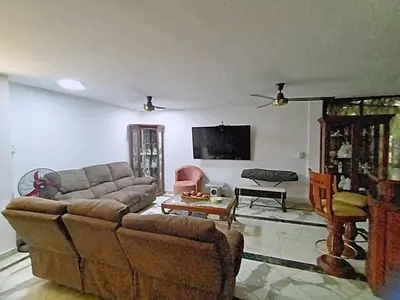 a living room with a couch and a table at Hotel Boutique - Casa Completa en Cartagena de Indias, barrio Castillogrande in Cartagena de Indias