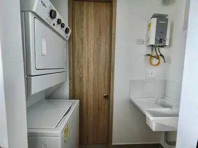 a small kitchen with a stove and a sink at Great sunsets & sea views, near beach&downtown in Cartagena de Indias