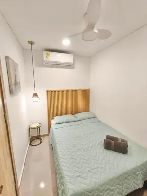 a bedroom with a bed and a ceiling fan at Great sunsets & sea views, near beach&downtown in Cartagena de Indias