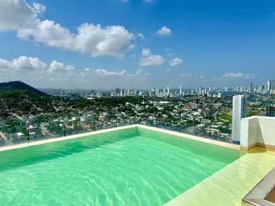 a swimming pool with a view of a city at Great sunsets & sea views, near beach&downtown in Cartagena de Indias