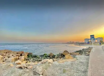 a beach with rocks and the ocean at sunset at Great sunsets & sea views, near beach&downtown in Cartagena de Indias