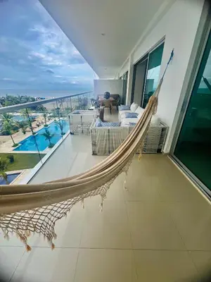 a hammock in a room with a view of the ocean at Morros EPIC OCEAN AND BEACH in Cartagena de Indias