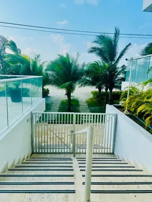 a staircase leading up to a building with palm trees at Morros EPIC OCEAN AND BEACH in Cartagena de Indias