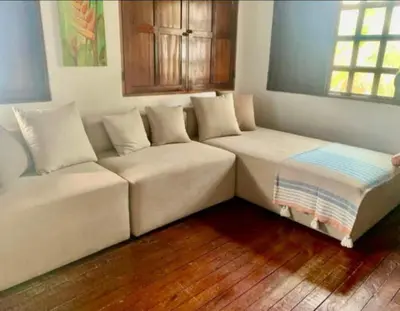 a living room with a couch and a window at ACUARELA in Trementino