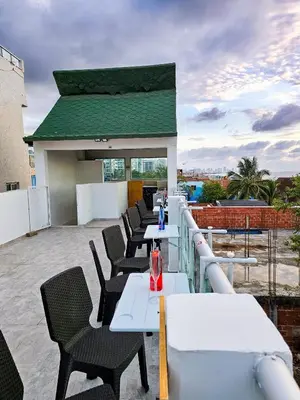 a row of tables and chairs on a roof at Casa Playa Boquilla in Cartagena de Indias