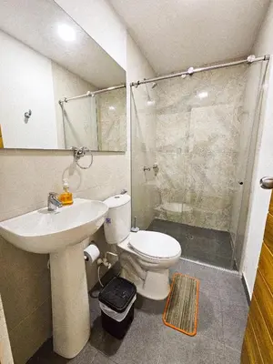 a bathroom with a toilet and a sink and a shower at Casa Playa Boquilla in Cartagena de Indias