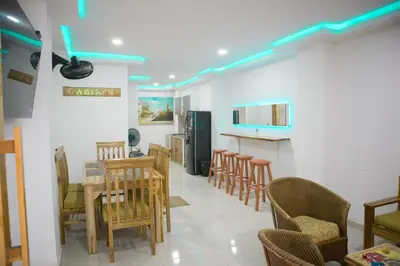 a dining room with a table and chairs at Casa Playa Boquilla in Cartagena de Indias