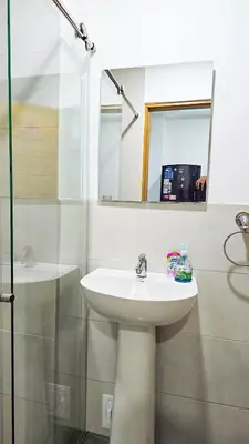 a bathroom with a sink and a mirror at Casa Playa Boquilla in Cartagena de Indias