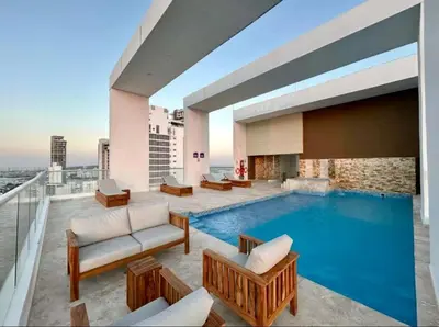 a swimming pool in a building with a view at Luxury Apartment In Bocagrande With Ocean View 502 in Cartagena de Indias