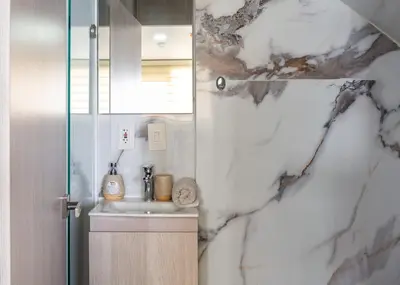 a bathroom with a sink and a mirror at Luxury Apartment In Bocagrande With Ocean View 502 in Cartagena de Indias