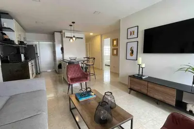 a living room with a couch and a flat screen tv at Vacation Home Apartment in Cartagena in Cartagena de Indias