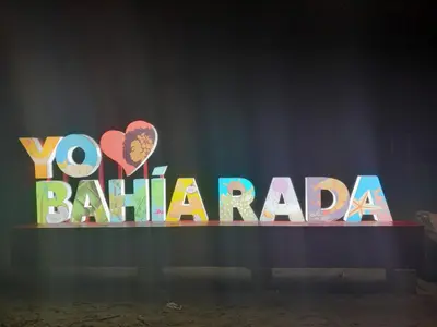 a sign that says yo bahama on a stage at Cabaña Villa July in Moñitos