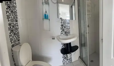 a bathroom with a sink and a toilet and a shower at Vista al Mar - 77Rentals in Cartagena de Indias