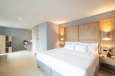 a bedroom with a large white bed in a room at Mood Matuna Hotel Cartagena in Cartagena de Indias
