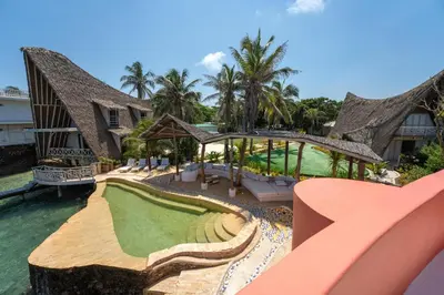 a resort with a putting green in the water at Isla Matamba in Isla Grande