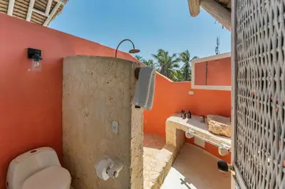 a bathroom with a toilet and a sink at Isla Matamba in Isla Grande