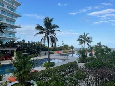 a view of a resort with a pool and palm trees at Morros 3 con salida al mar y Piscina in Cartagena de Indias