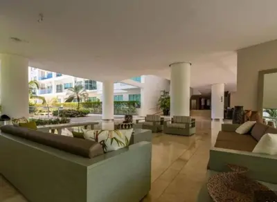a lobby with couches and tables in a building at Morros 3 con salida al mar y Piscina in Cartagena de Indias