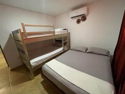 a small bedroom with a bunk bed and a bunk bed gmaxwell gmaxwell gmaxwell at Casa Boutique Rincon in San Onofre