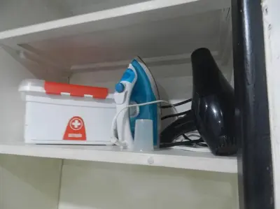 a shelf with a hair dryer and a phone on it at la Ola de la Vida con AA WIFI in Cartagena de Indias