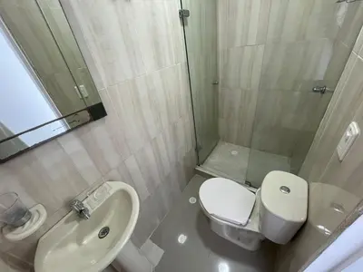 a bathroom with a sink and a toilet and a shower at Portofino Cartagena Bocagrande 604 ICDI in Cartagena de Indias