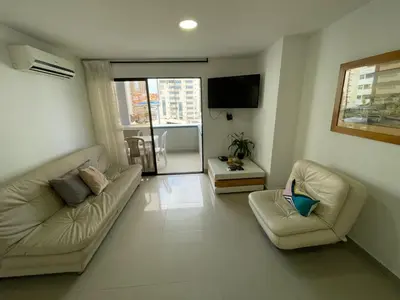 a living room with two couches and a flat screen tv at Portofino Cartagena Bocagrande 604 ICDI in Cartagena de Indias