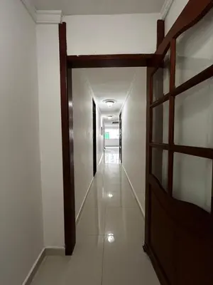 an empty hallway with a door in a building at Antares Apartment in Cartagena de Indias