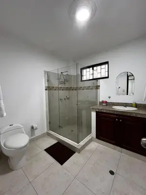a bathroom with a shower and a toilet and a sink at Antares Apartment in Cartagena de Indias