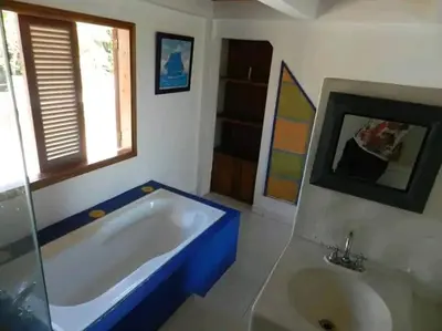 a bathroom with a large tub and a window at La Boquilla, Cartagena, Hospedaje, Turismocolombia-fit in Cartagena de Indias