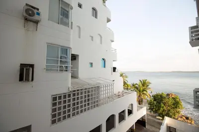 a building with a view of the ocean at Caribbean Summer - Livin Colombia in Cartagena de Indias