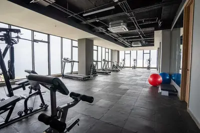 a gym with several treadmills and exercise machines at U-GO Vistas al Mar desde Murano Centro: Piscina, Jacuzzi y Más in Cartagena de Indias