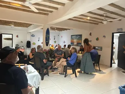 a group of people sitting in a room at Hotel Juanmar in Juan de Acosta