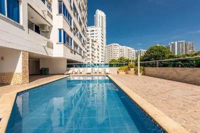 a swimming pool in front of a building at Apartamento bonito en Cartagena ,el laguito bocagrande con vista al mar in Cartagena de Indias